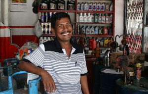 Business Services - A_successful_auto-garage_store_owner_in_Banda_Aceh-1-300x190