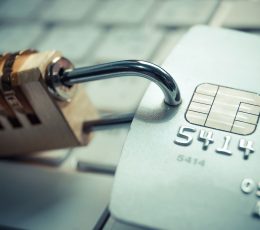 a credit card with a padlock attached to it.