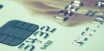 a close up of a credit card with a rose on it.