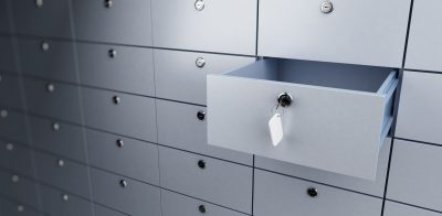 a bunch of lockers with a tie hanging on them.